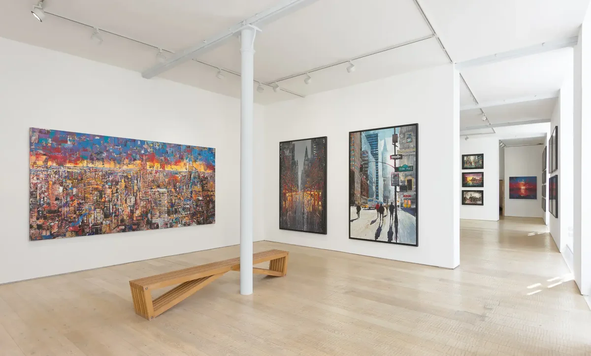 White studio with large paintings on canvas and aluminium
